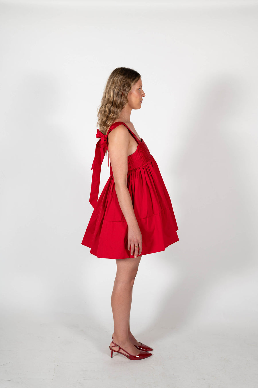 Side View of the Dolly Mini Party Dress in Red Taffeta by House of Campbell.