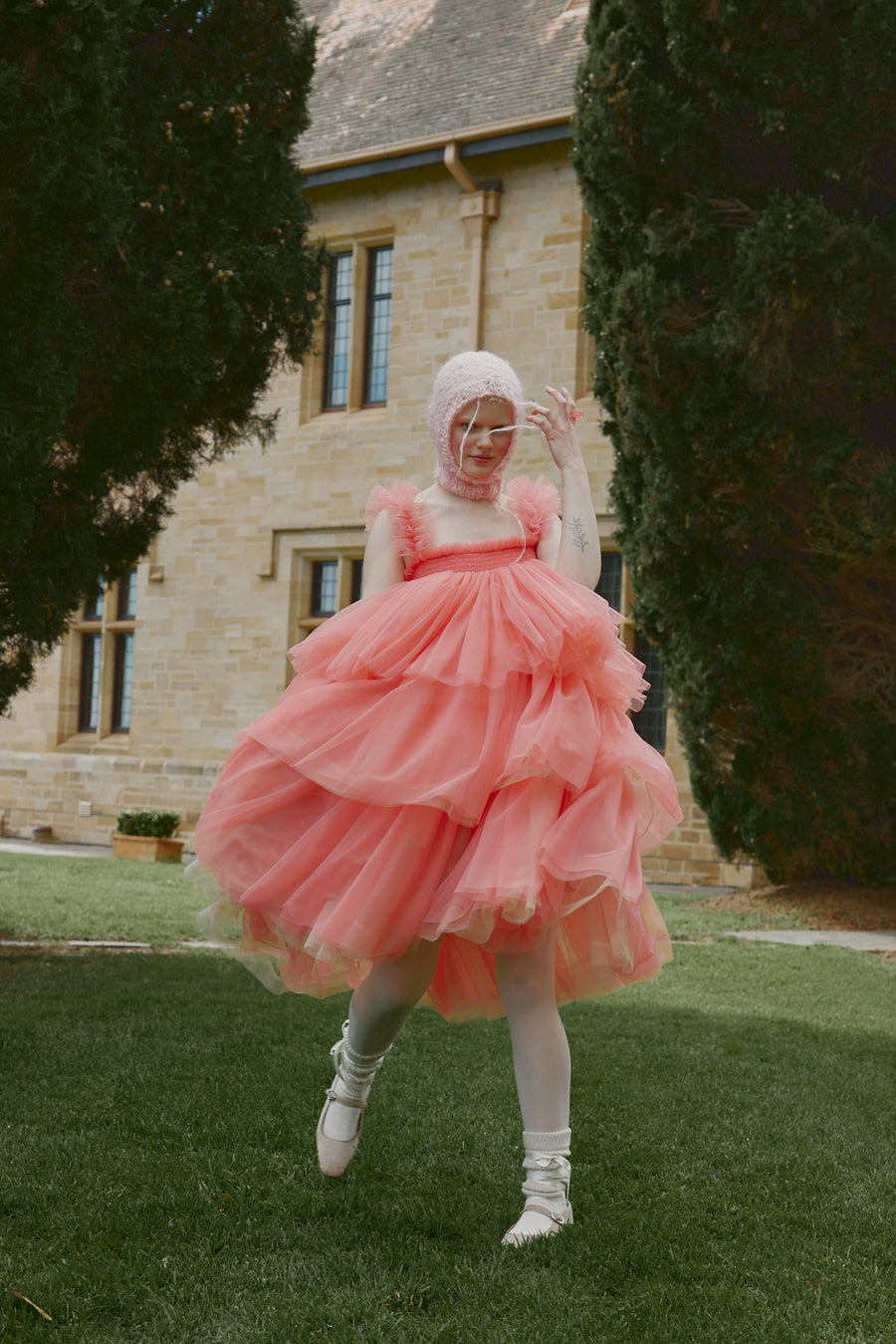 Model spins in the Australian Made Mariposa Tulle Midi dress by House of Campbell.