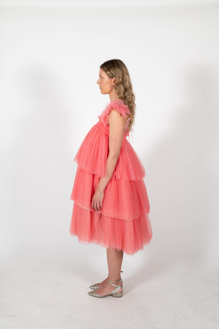 Side view of the tulle ruffle Mariposa Midi Dress in sorbet pink by House of Campbell.