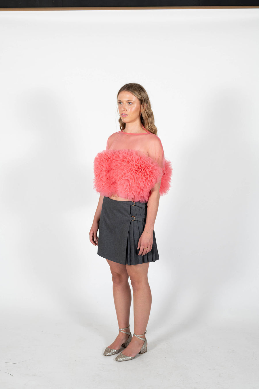 Angled view of the Camille Tulle Ruffle Top in sorbet pink by Australian designer labelHouse of Campbell