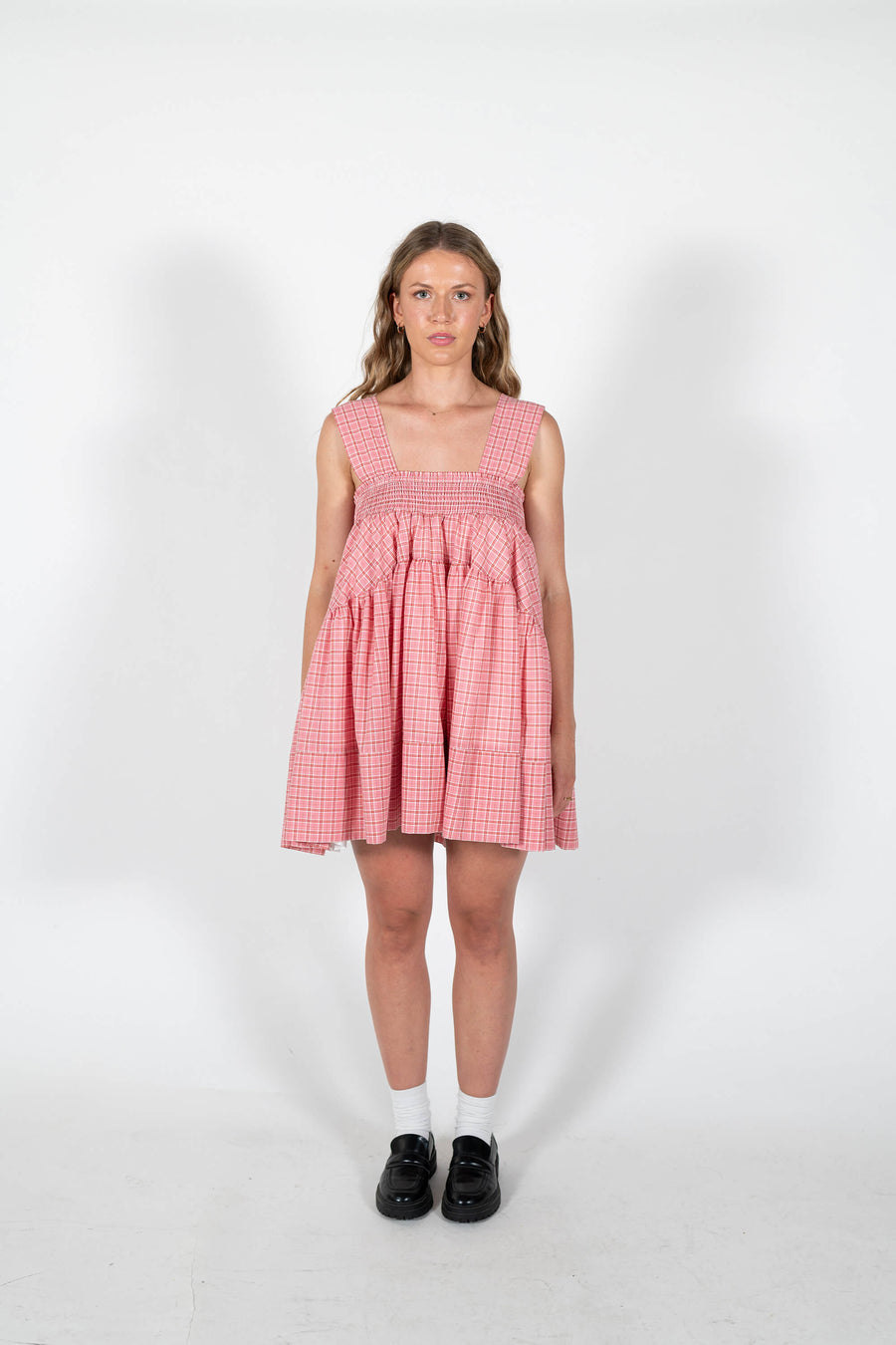 Nellie wears the Spring Summer Mirabel Dress in Rose Pink plaid.
